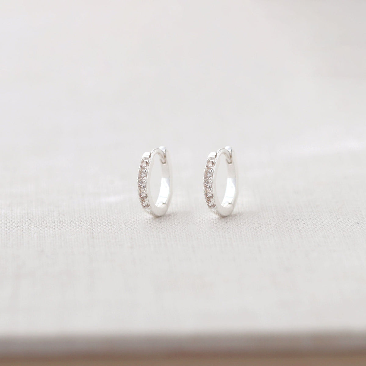 Kris Nations Womens Crystal Huggie Hoop Earrings - Sterling Silver / Crystal - Sterling Silver / Crystal